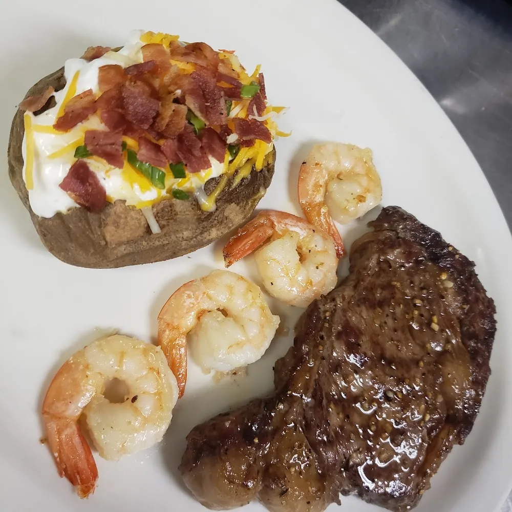 Ribeye Steak with Shrimp and Loaded Potato